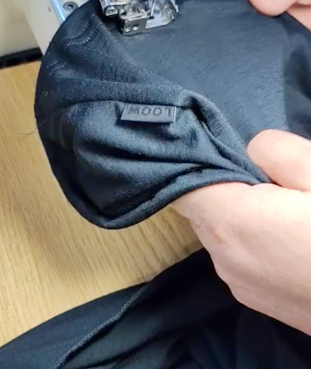 Finishing a seam at Monika's sewing studio